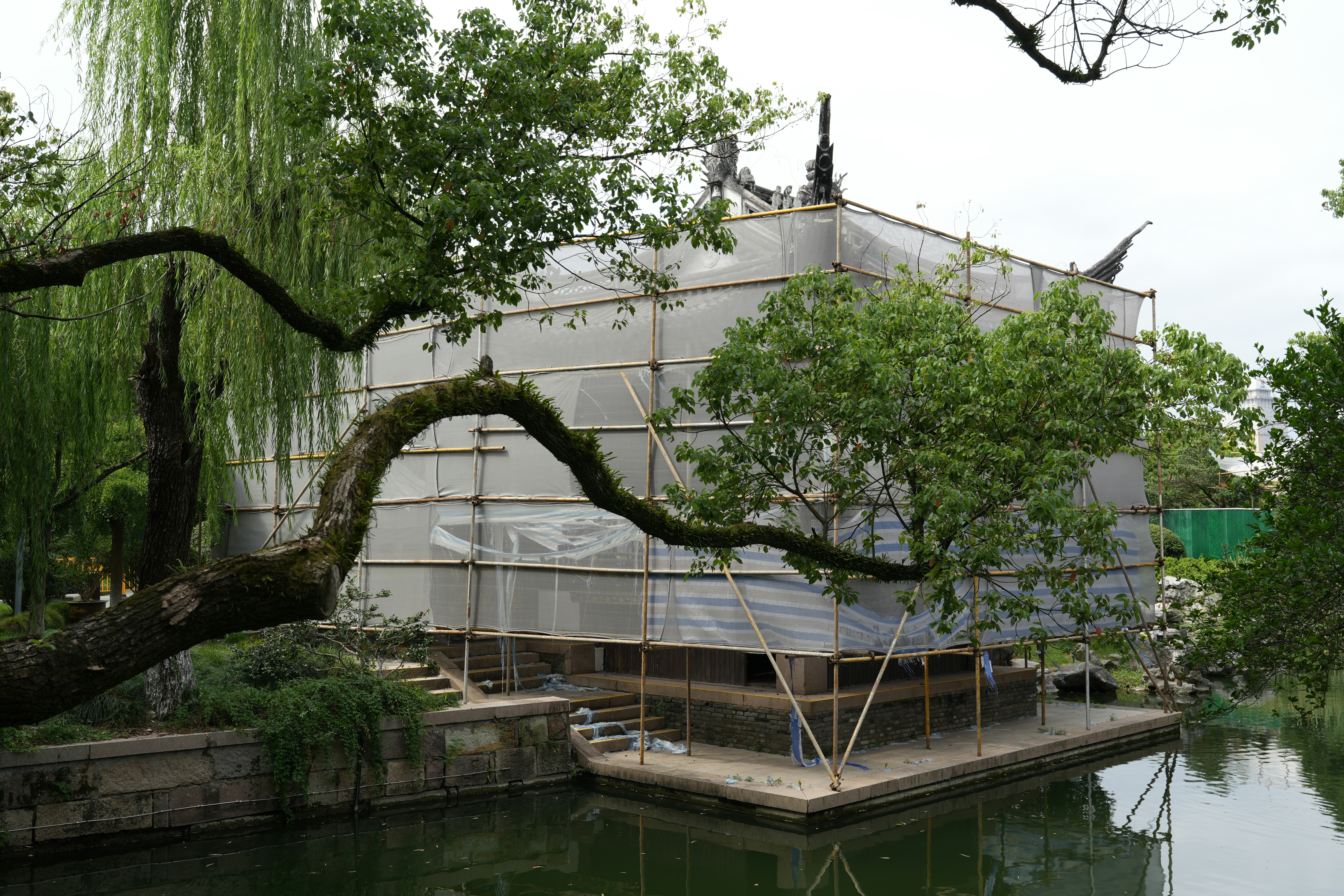 Building under construction covered in white sheeting.