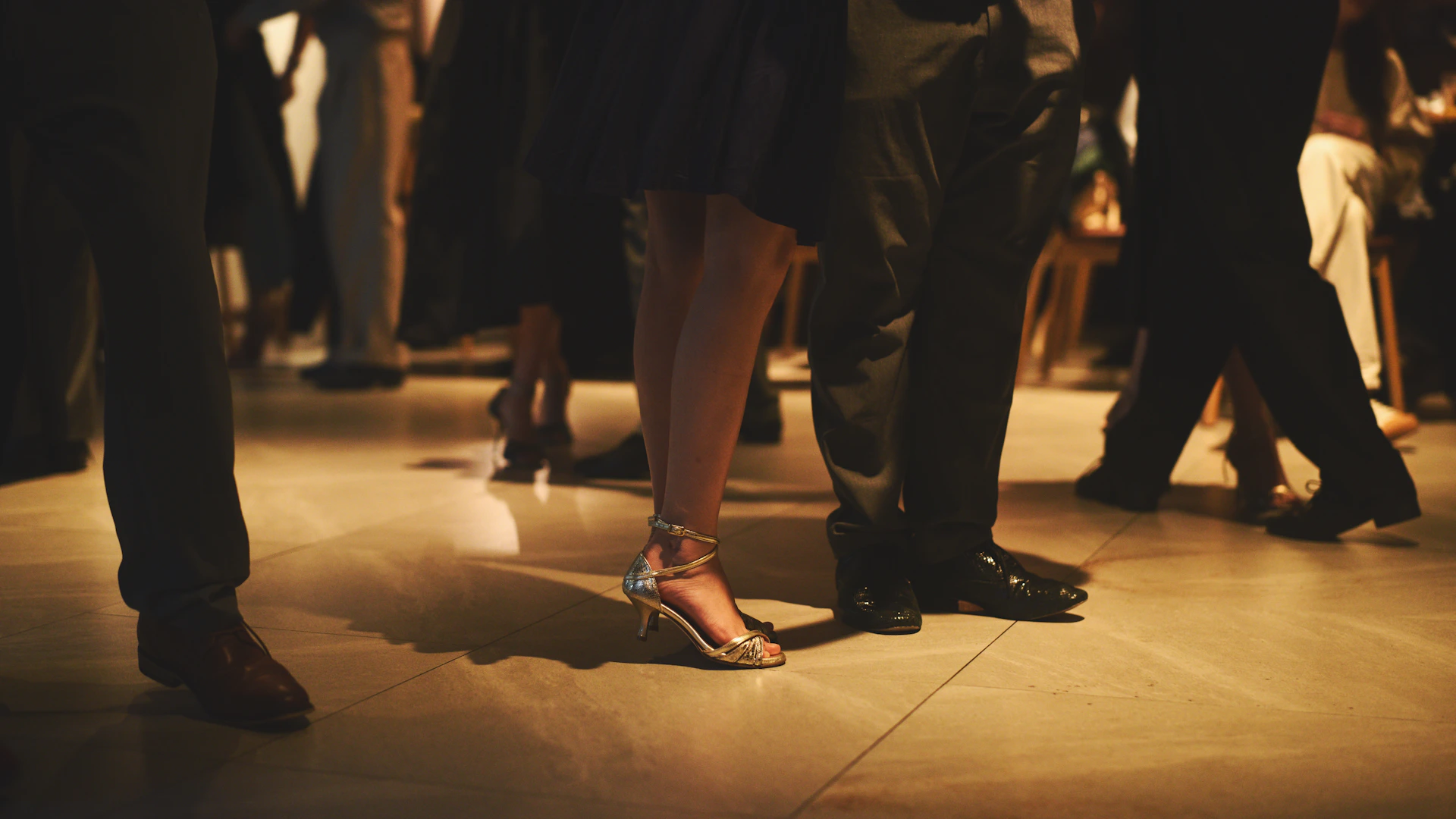 People dancing at a formal event with elegant shoes