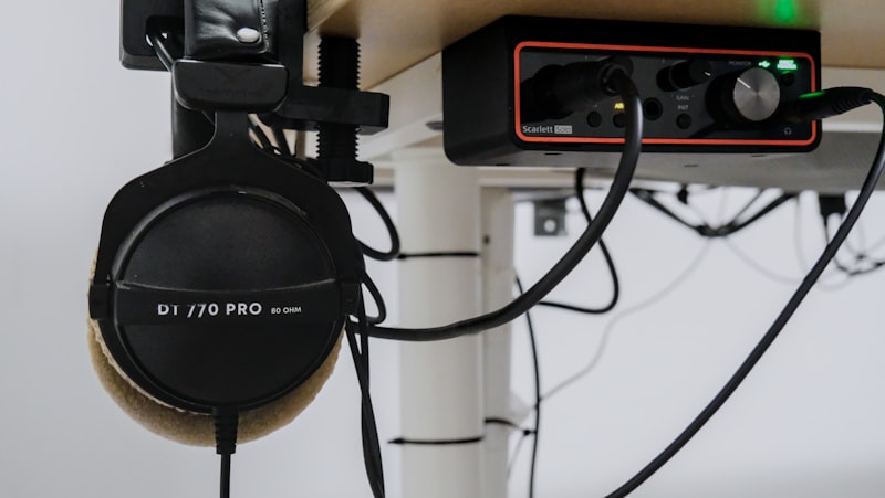 Audio interface and headphones on a desk