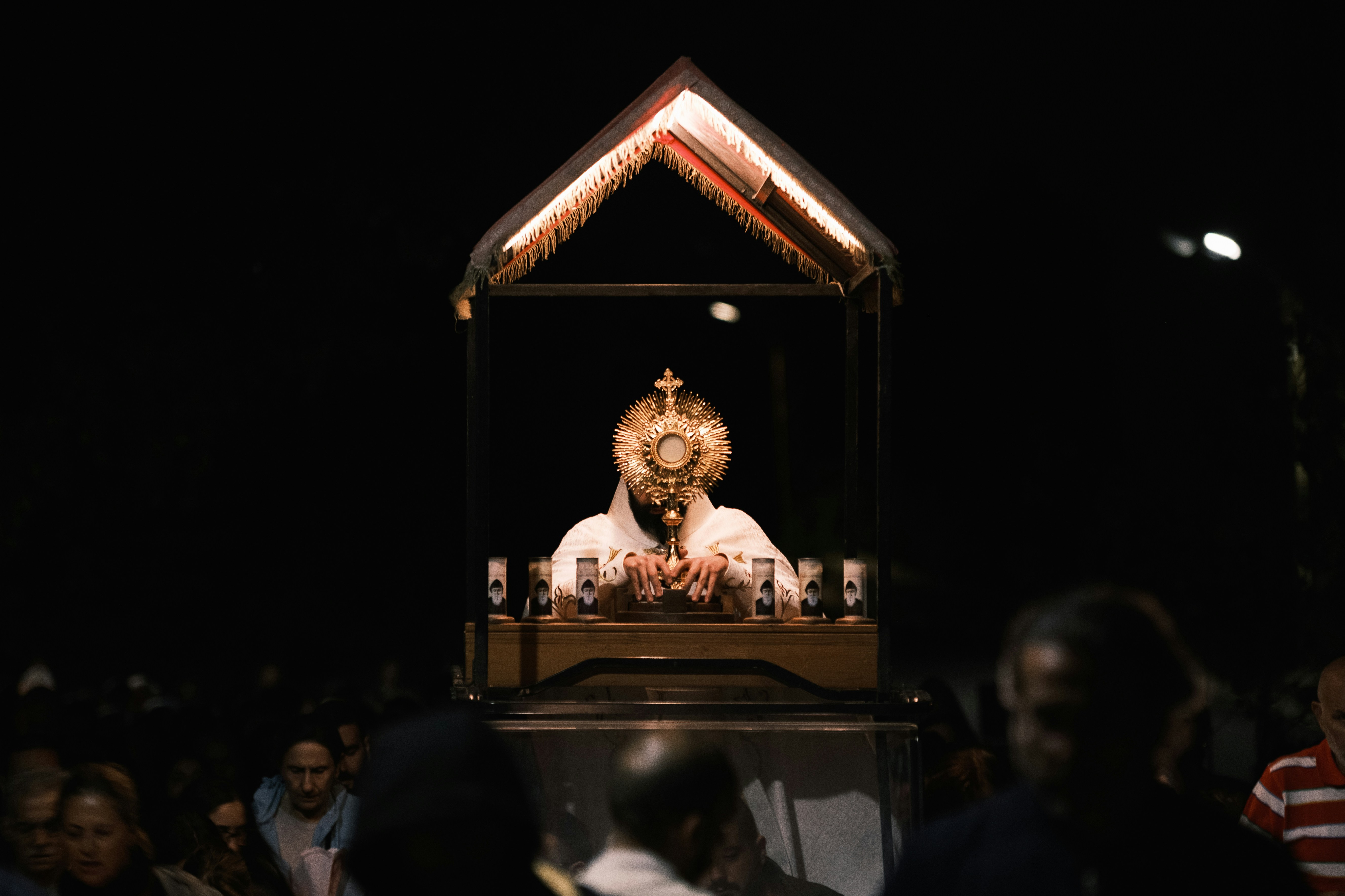 Religious procession with a monstrance and crowd