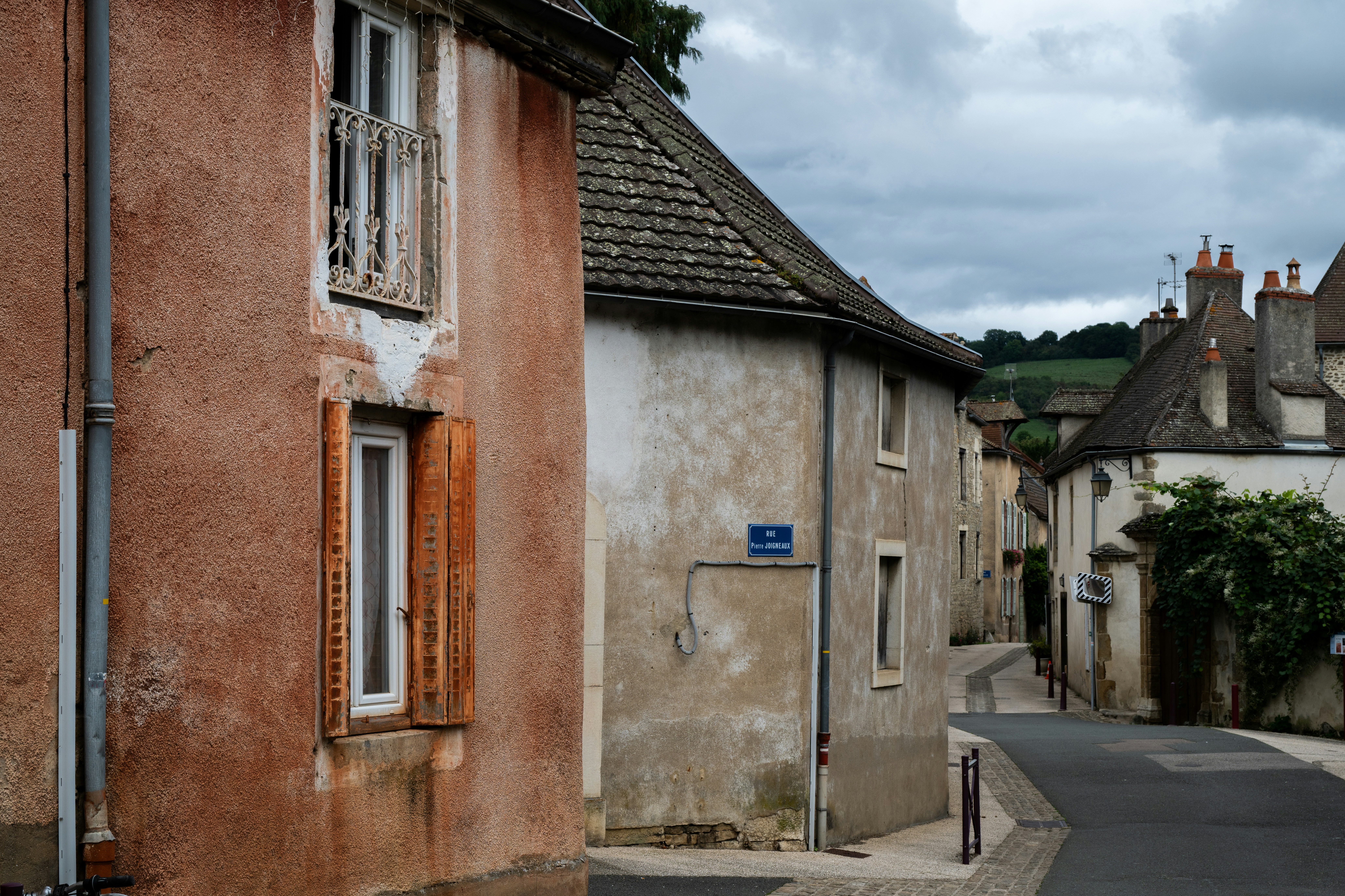 Narrow street with old buildings in a french village.