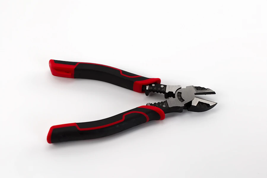 Wire stripper and crimper pliers with red and black handles