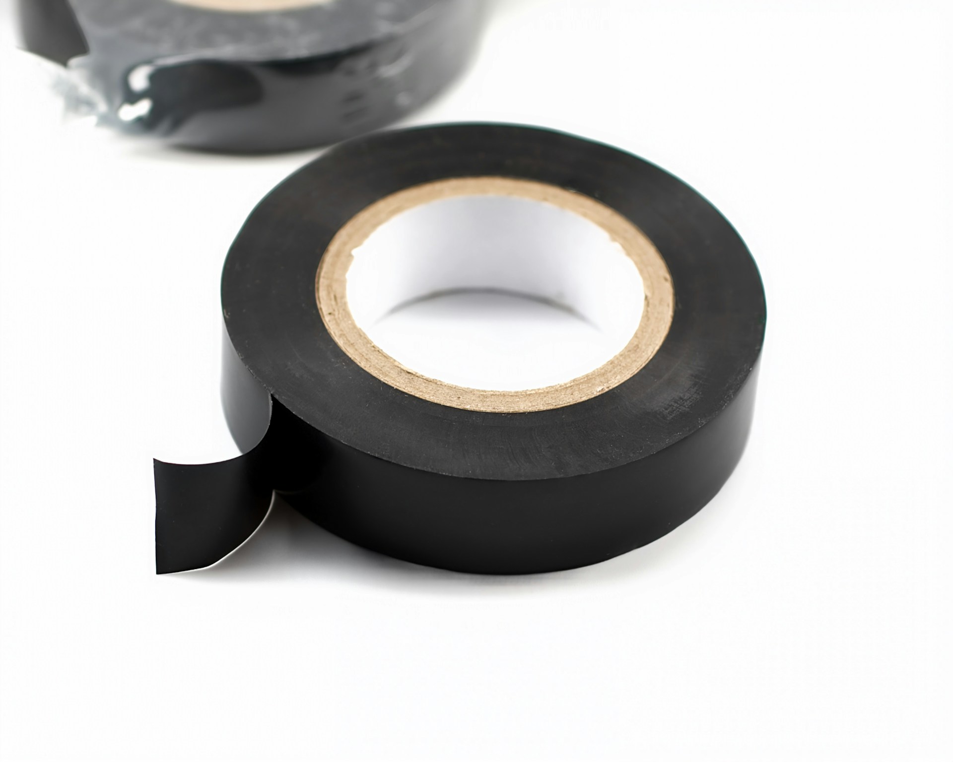 Roll of black electrical tape on white background