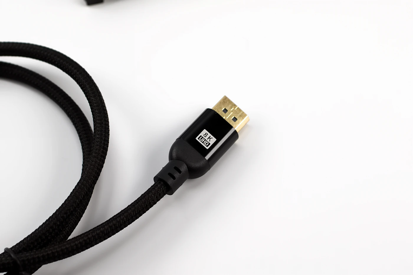 A braided HDMI cable with a gold connector