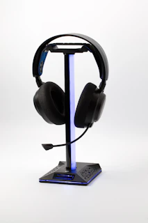 Black gaming headset on a lighted stand