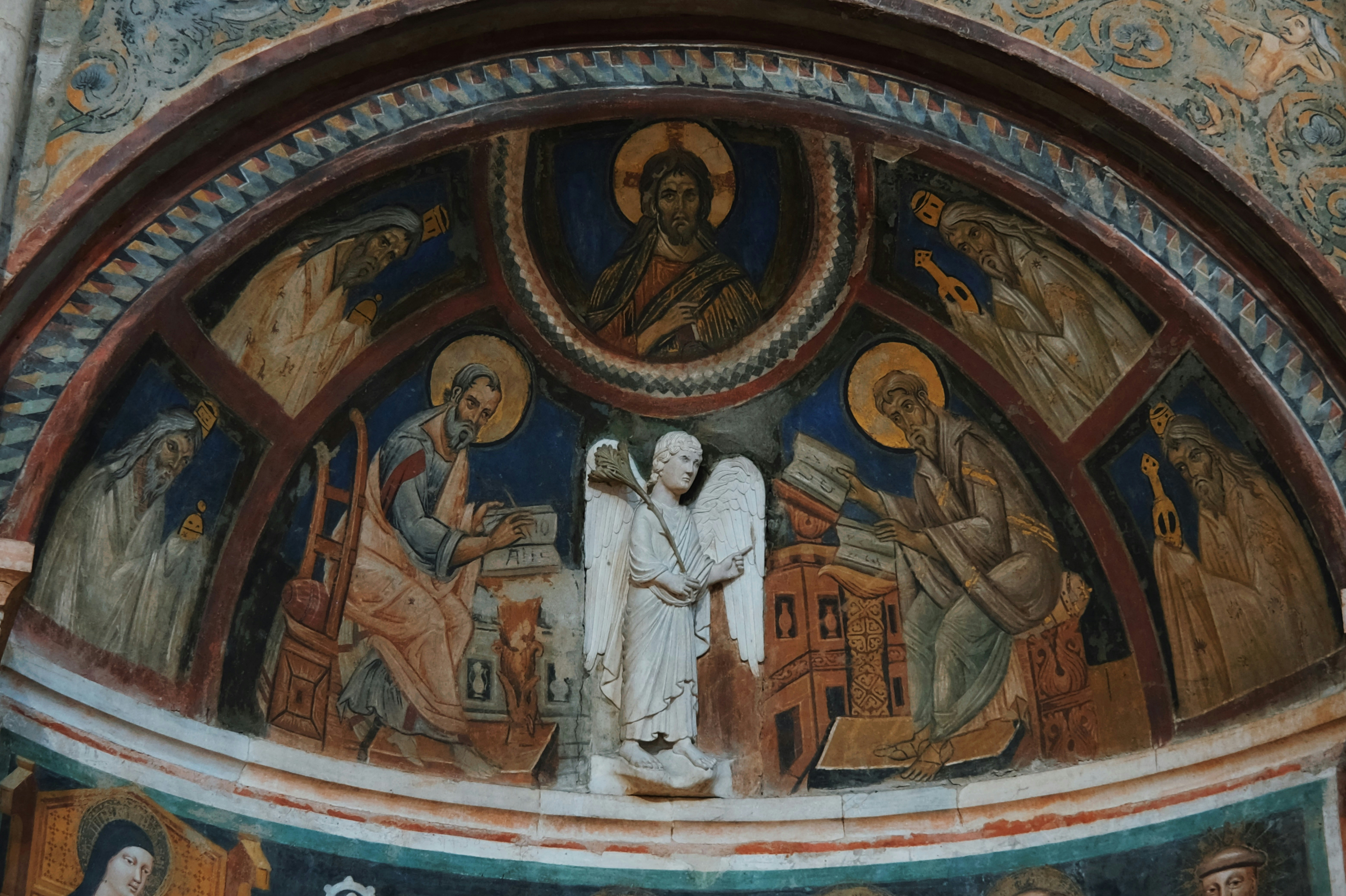 Fresco painting of an angel and religious figures