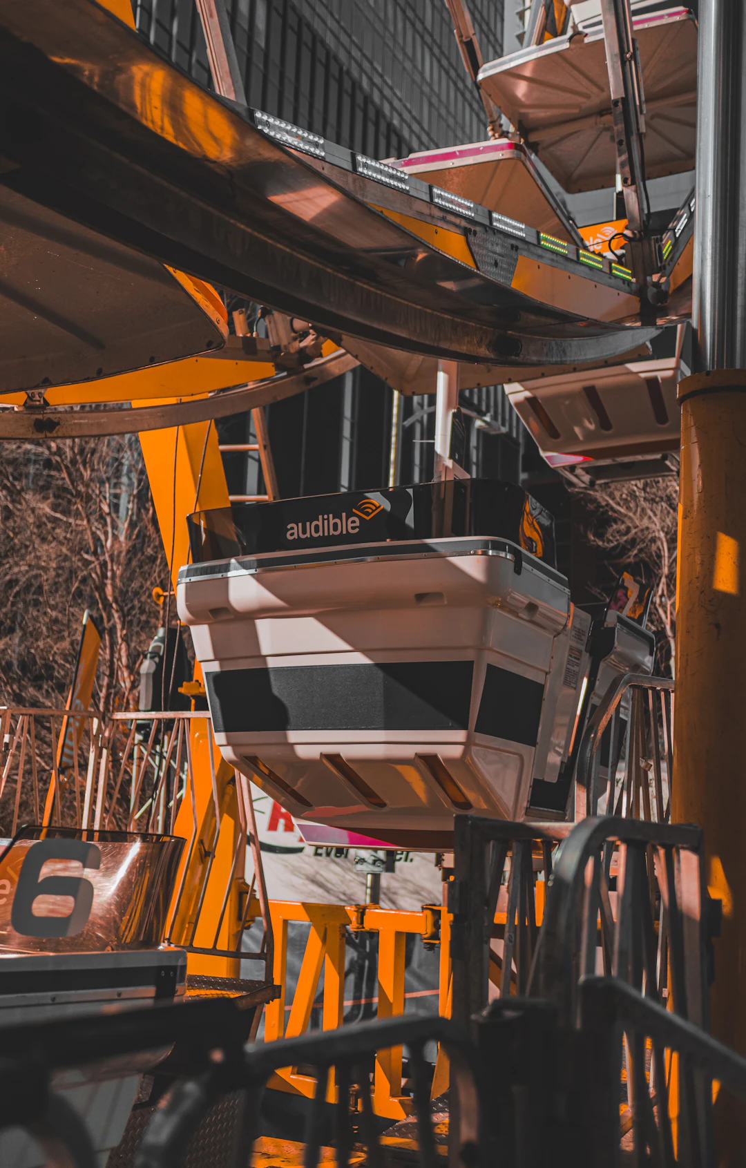 Ferris wheel gondola with Audible logo and number six