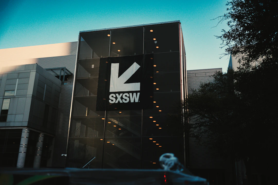SXSW building with large logo under blue sky