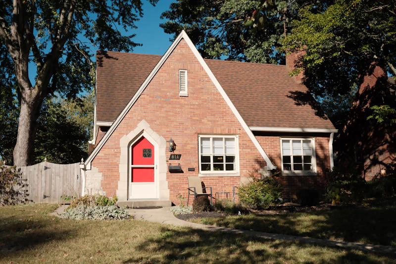 Charming brick home with a red front door and traditional character