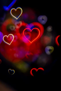 Abstract heart shapes glowing in the dark