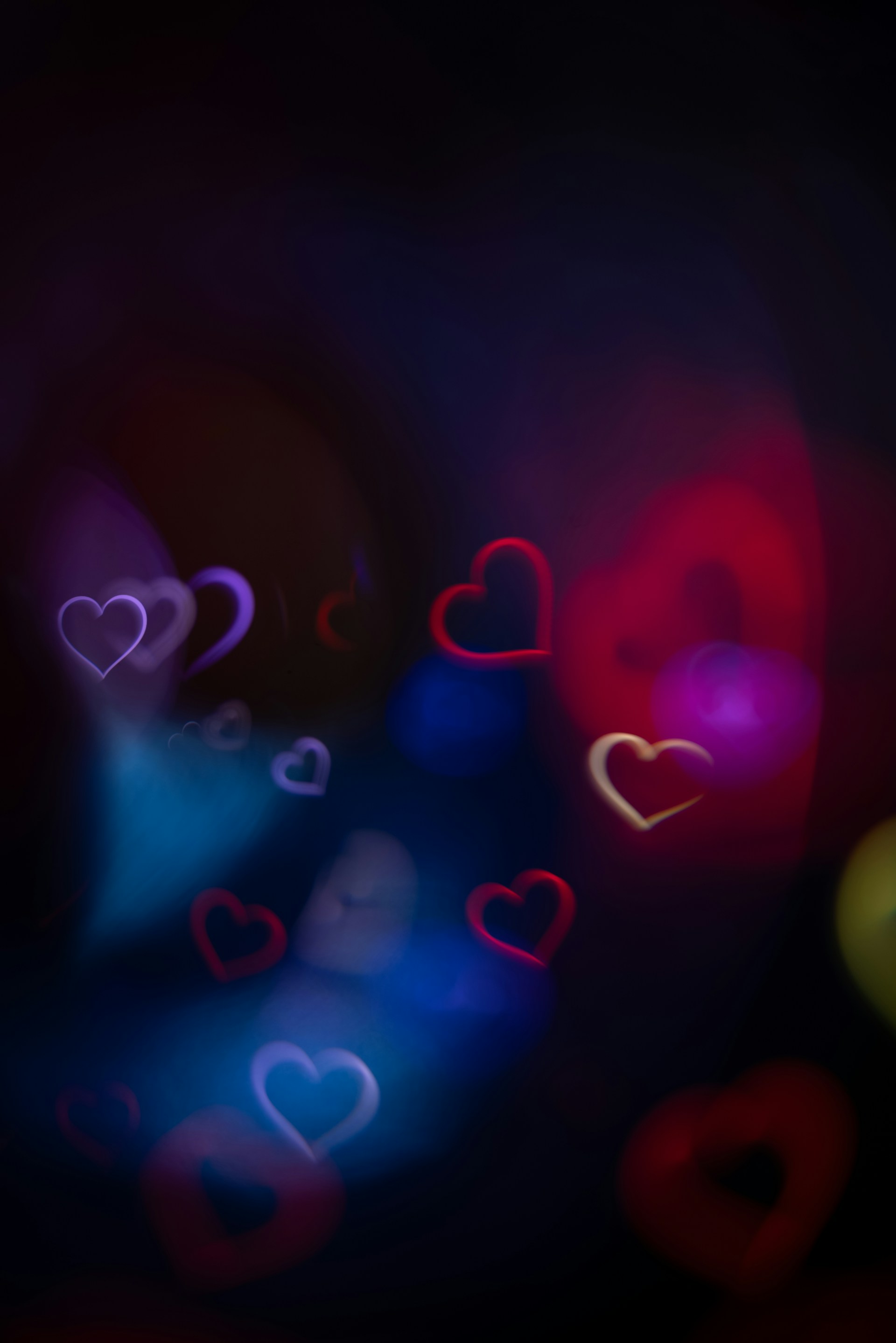Blurred heart shapes with colorful lights