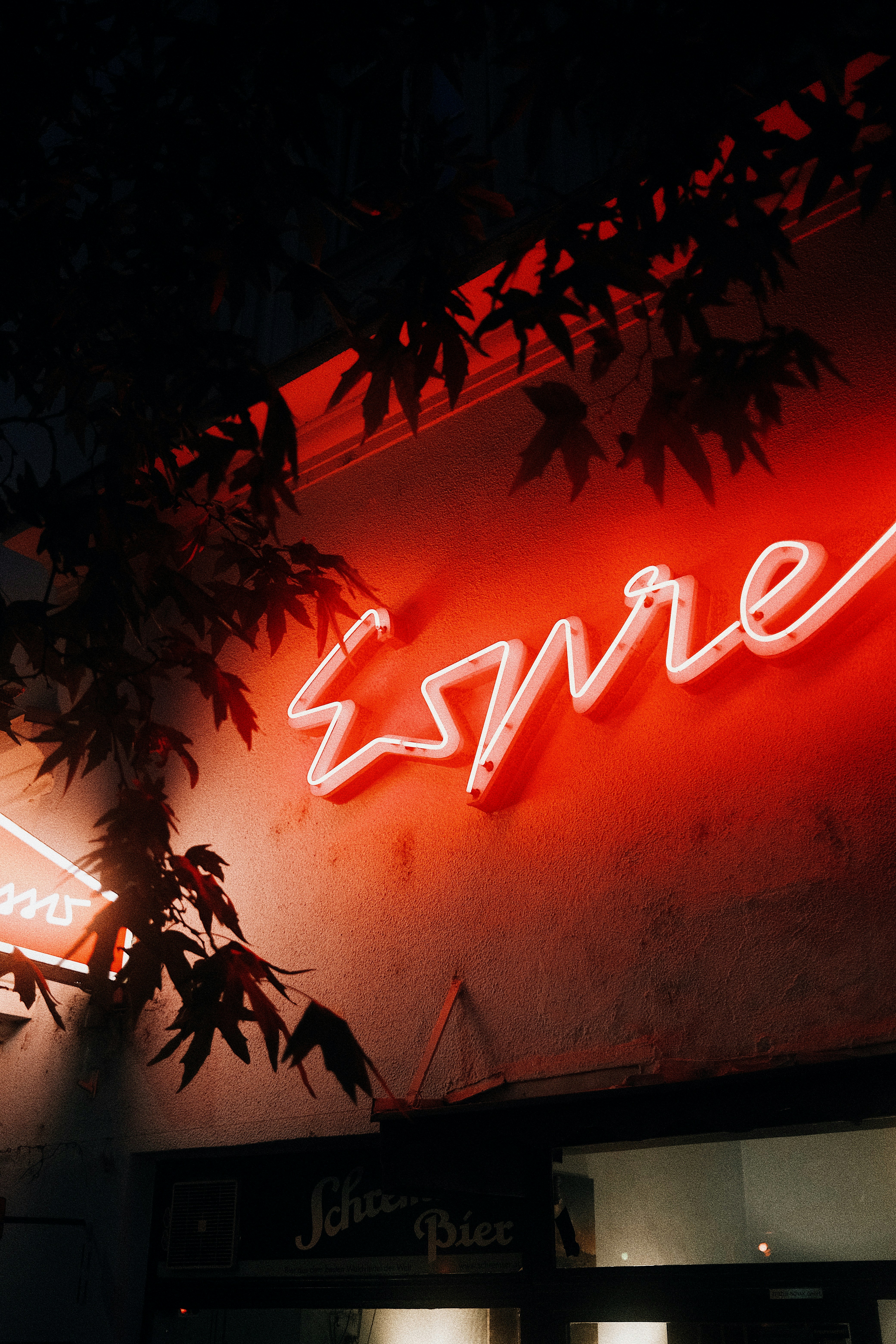 Red neon sign for espresso at night