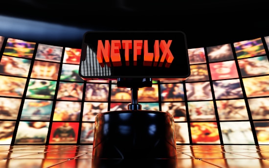 Netflix logo displayed on a screen with movie posters.
