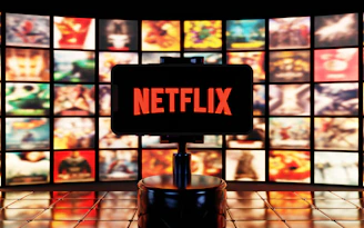 Netflix logo displayed on a screen with many movie posters.