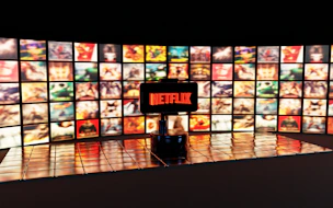 Netflix logo displayed on a wall of movie posters
