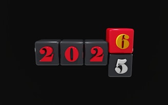 The numbers 2026 and 2025 on dice
