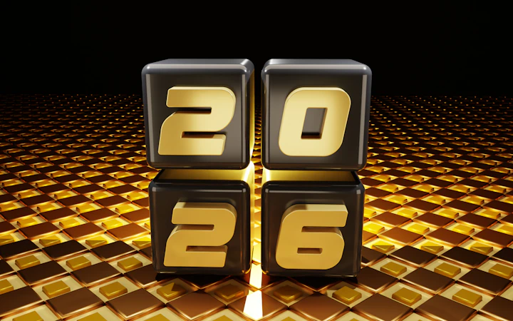 Four cubes displaying the numbers 2026