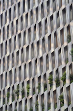 Modern building facade with repeating geometric window patterns.
