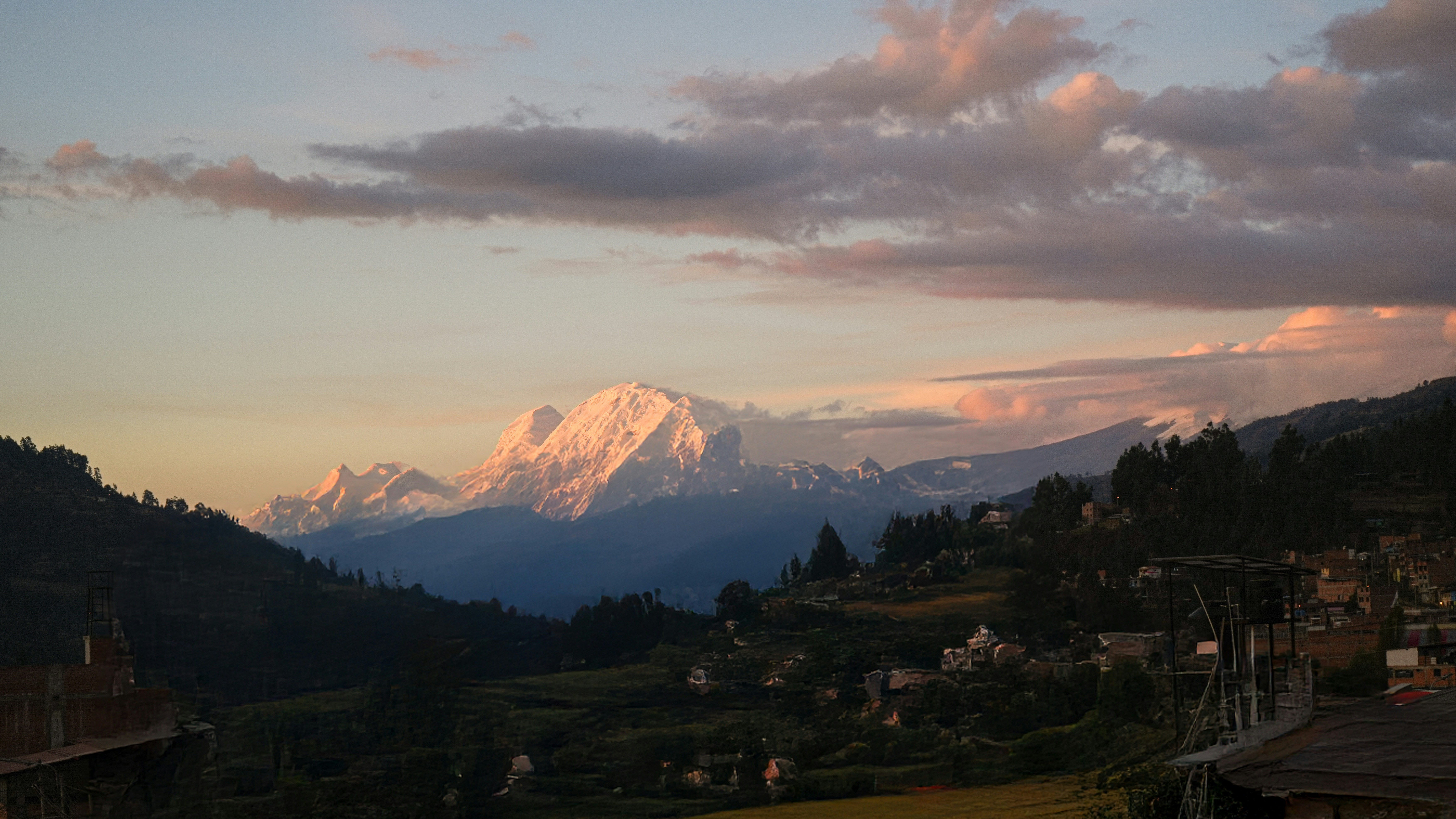 Snow-capped mountains bathed in sunset light