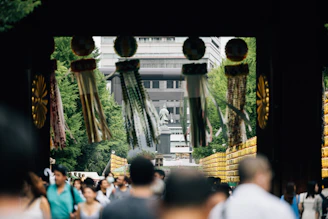 People walking through a japanese shrine gate