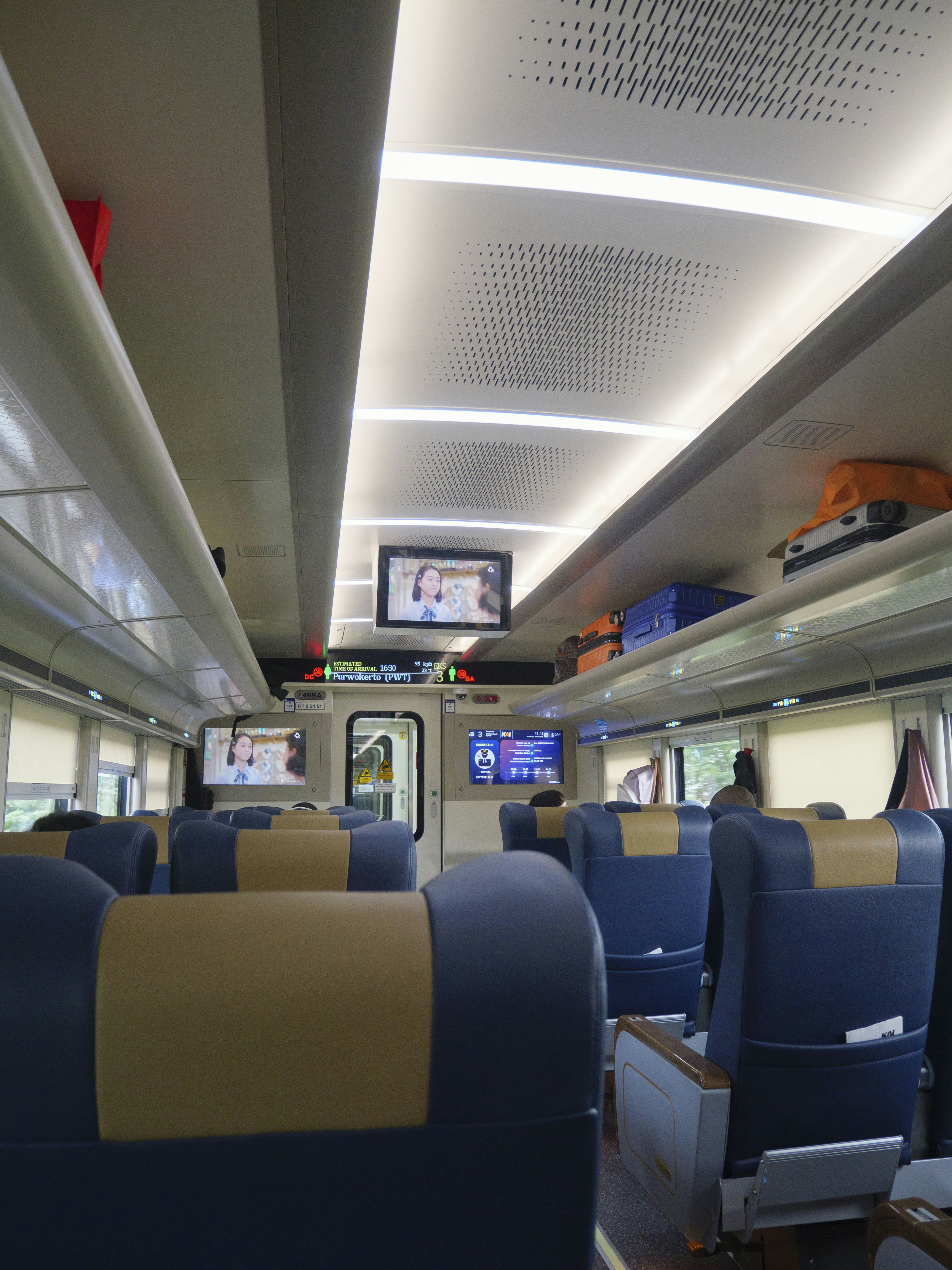 Luxury coach interior with comfortable seating and entertainment system