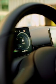 Digital dashboard of a modern car interior.