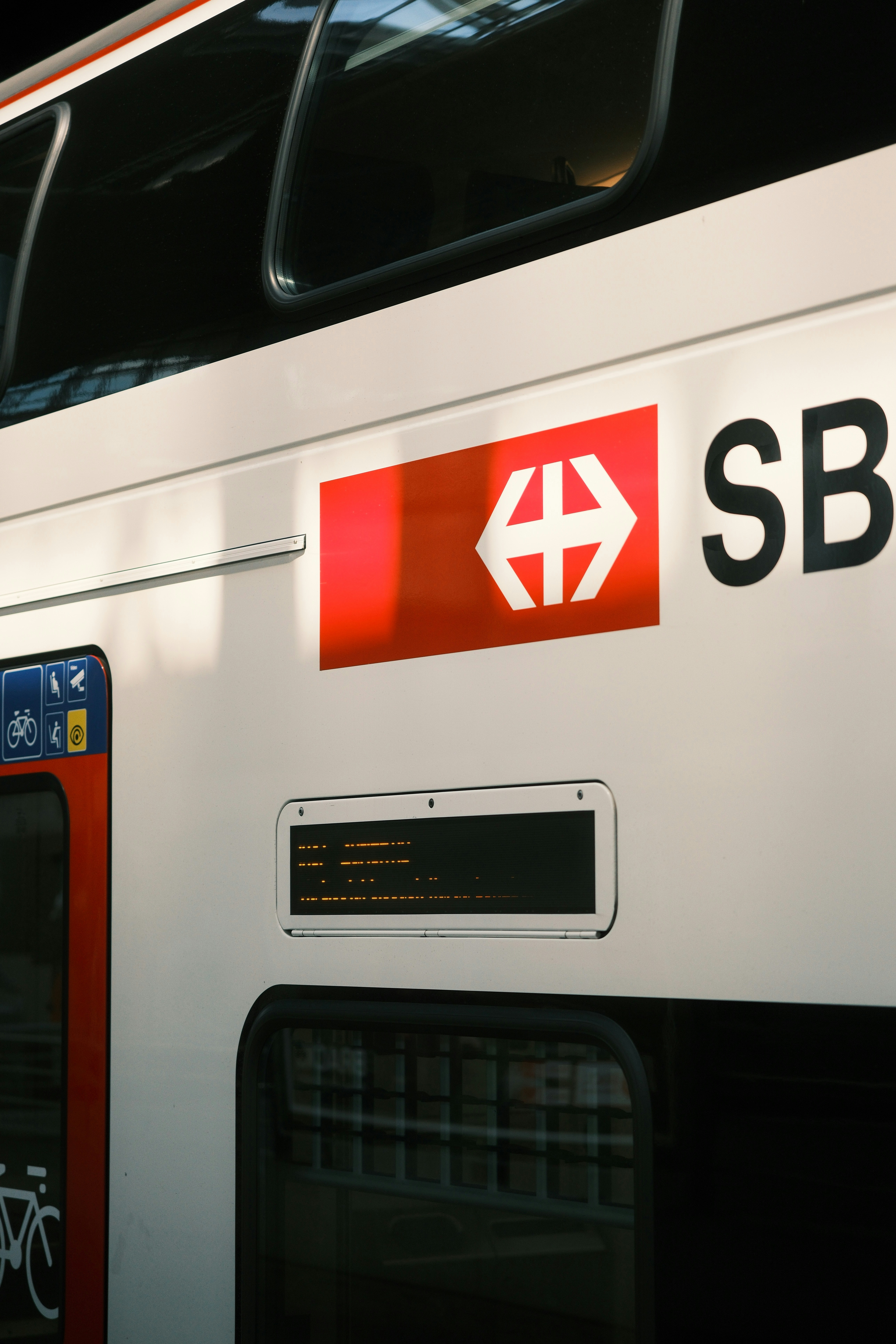 Swiss sbb train with red and white logo.