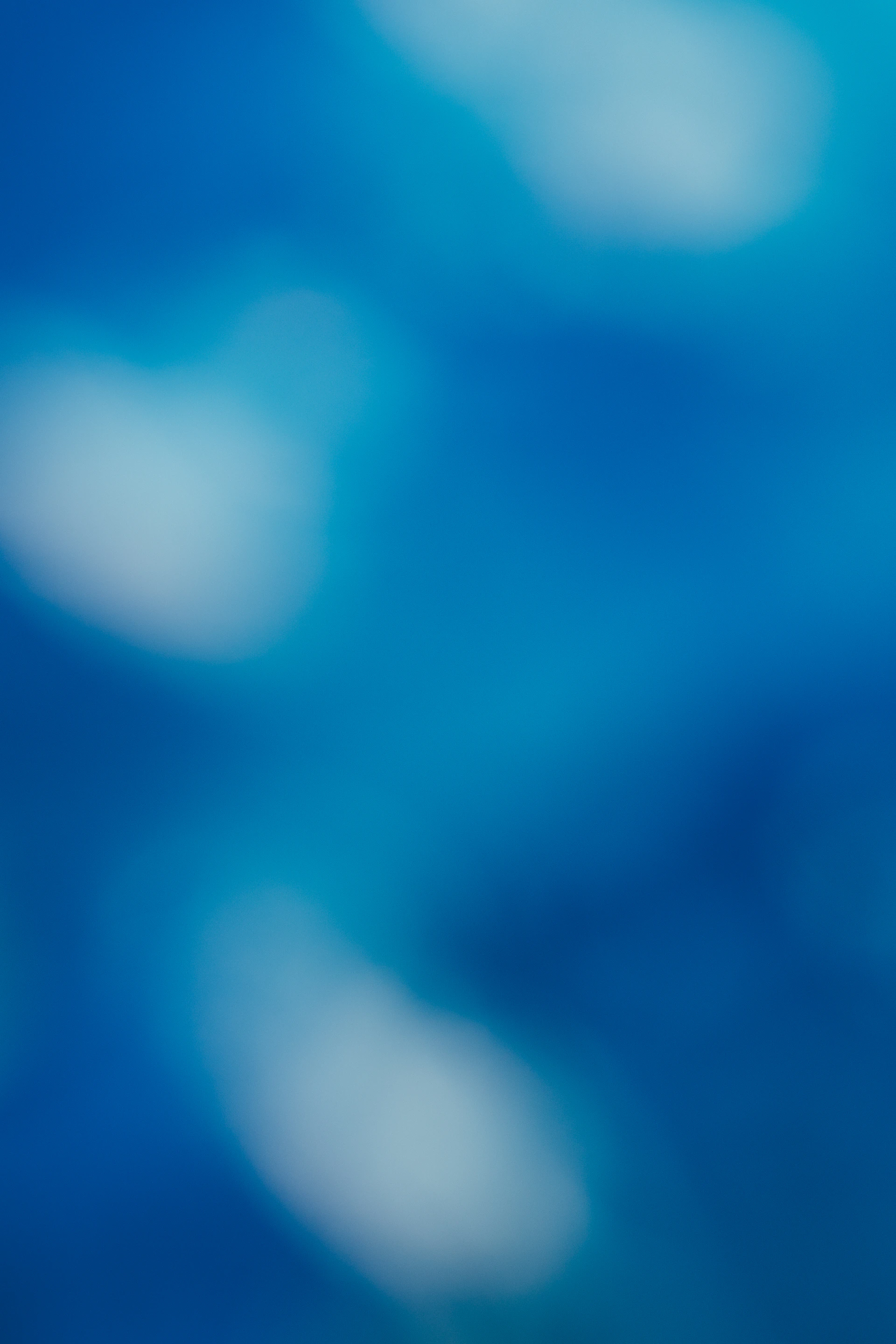 Abstract blue background with blurred light spots
