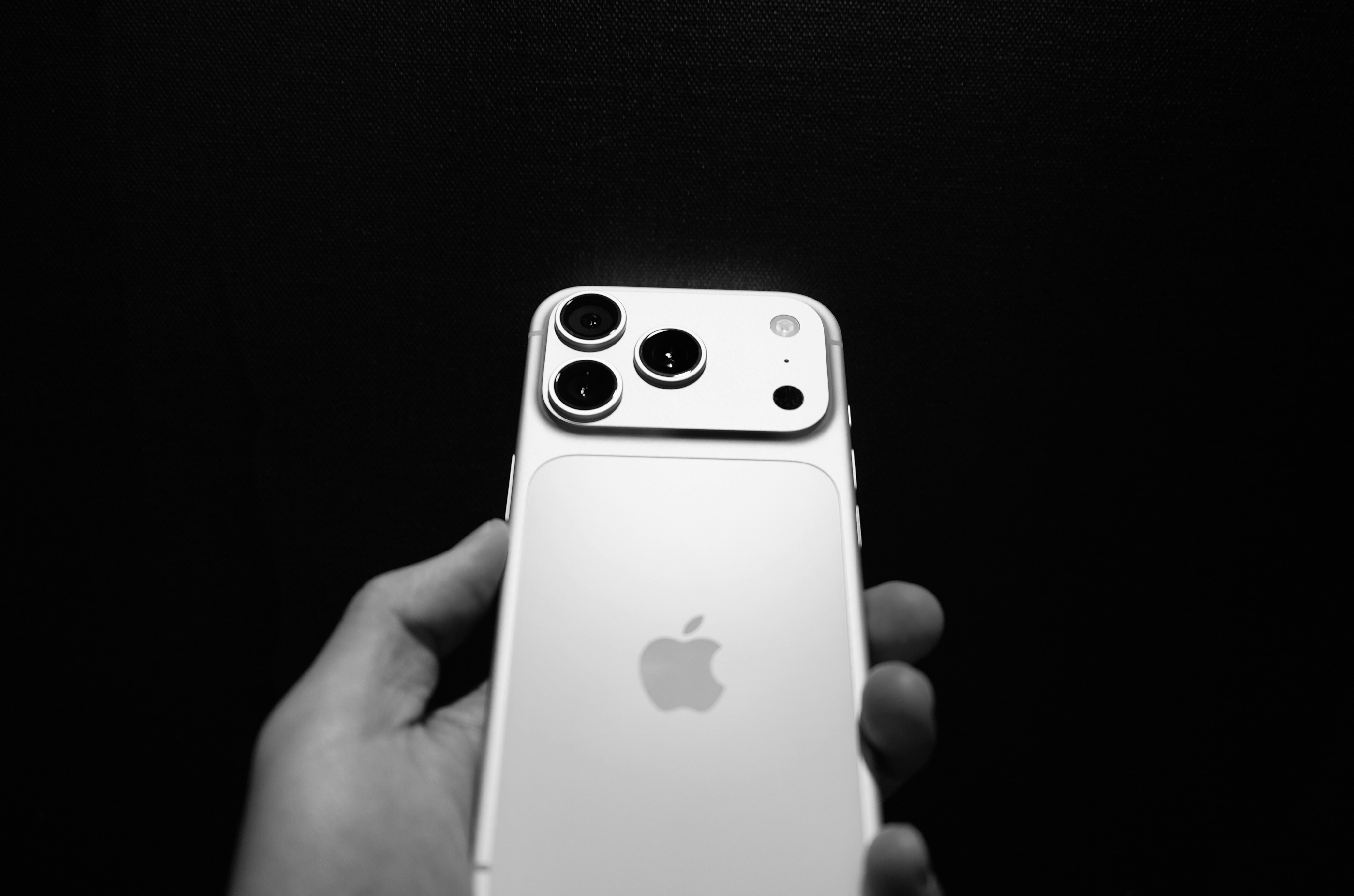 Hand holding smartphone showing Instagram interface