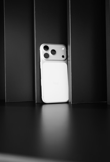 Modern smartphone with triple camera on dark background