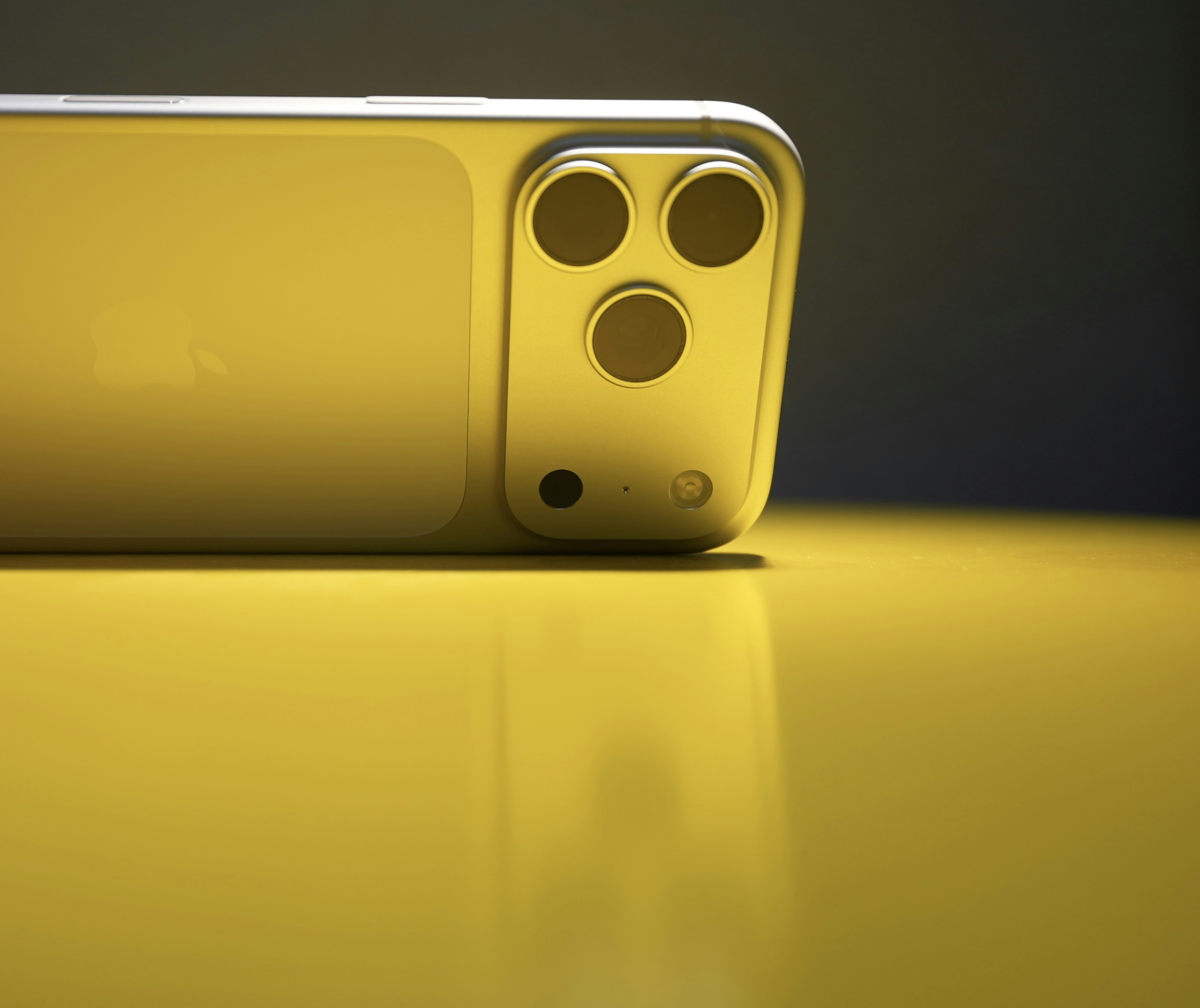 Yellow smartphone with triple camera system