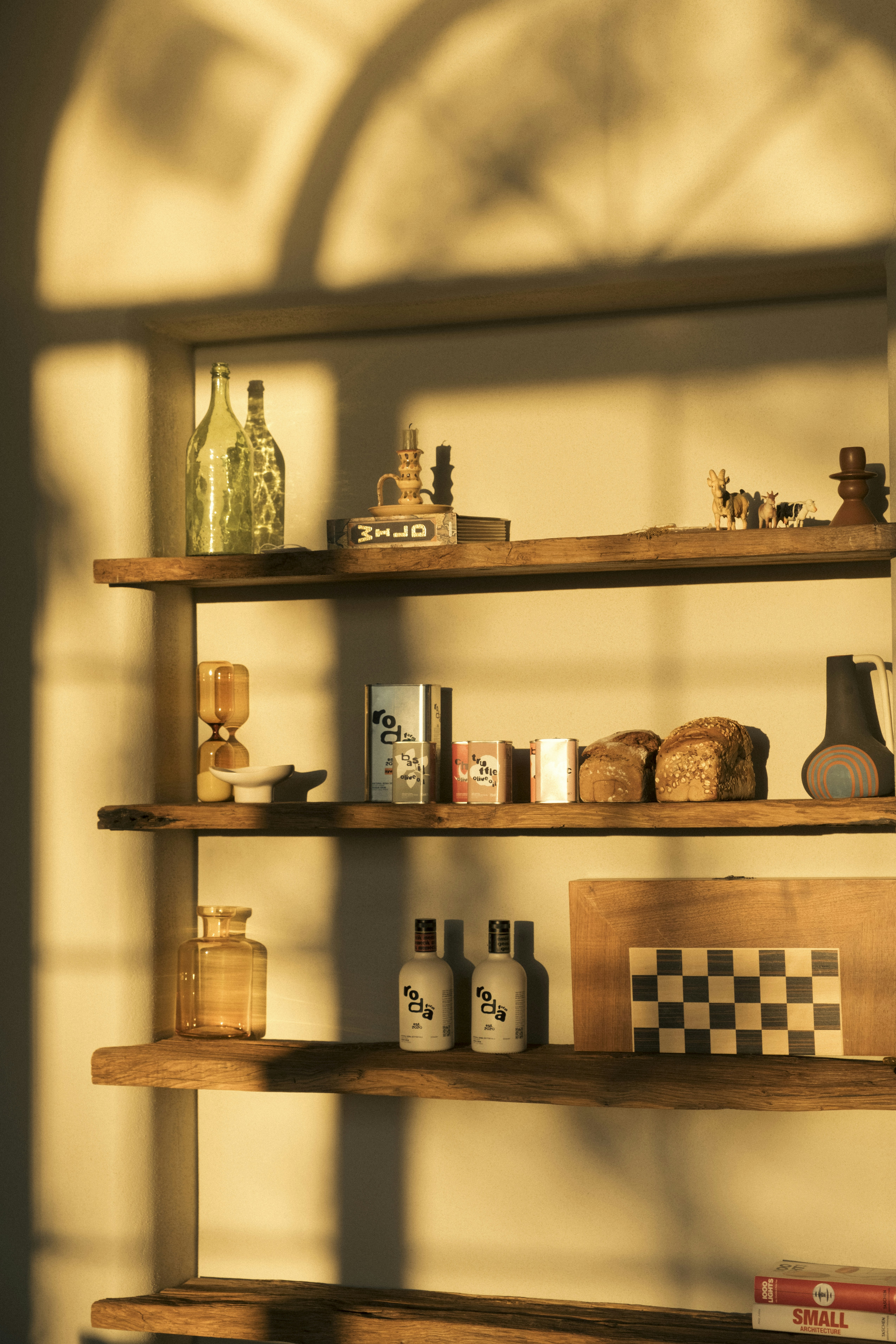 Wooden shelves with various objects and warm lighting