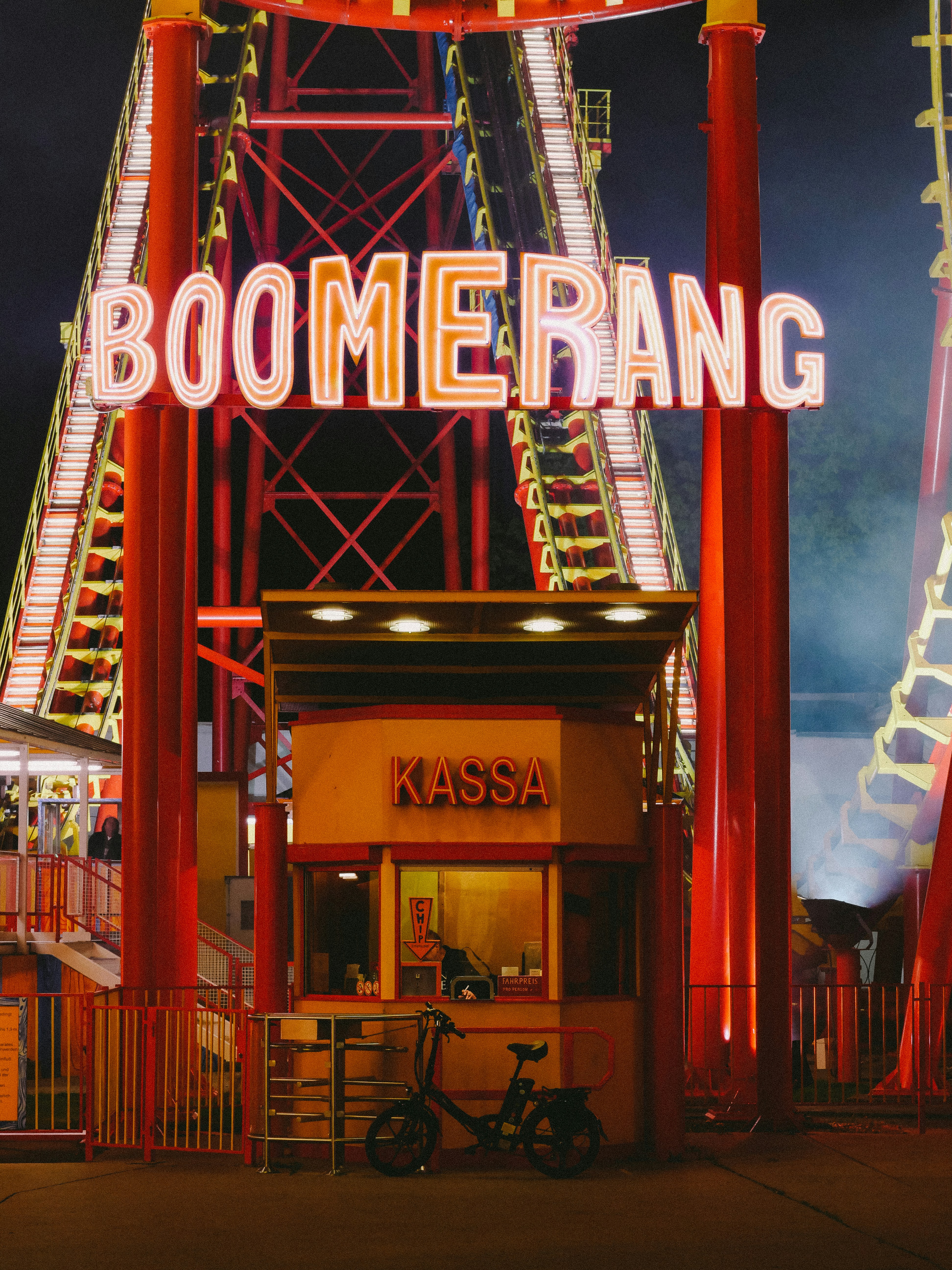 Roller coaster entrance with neon \