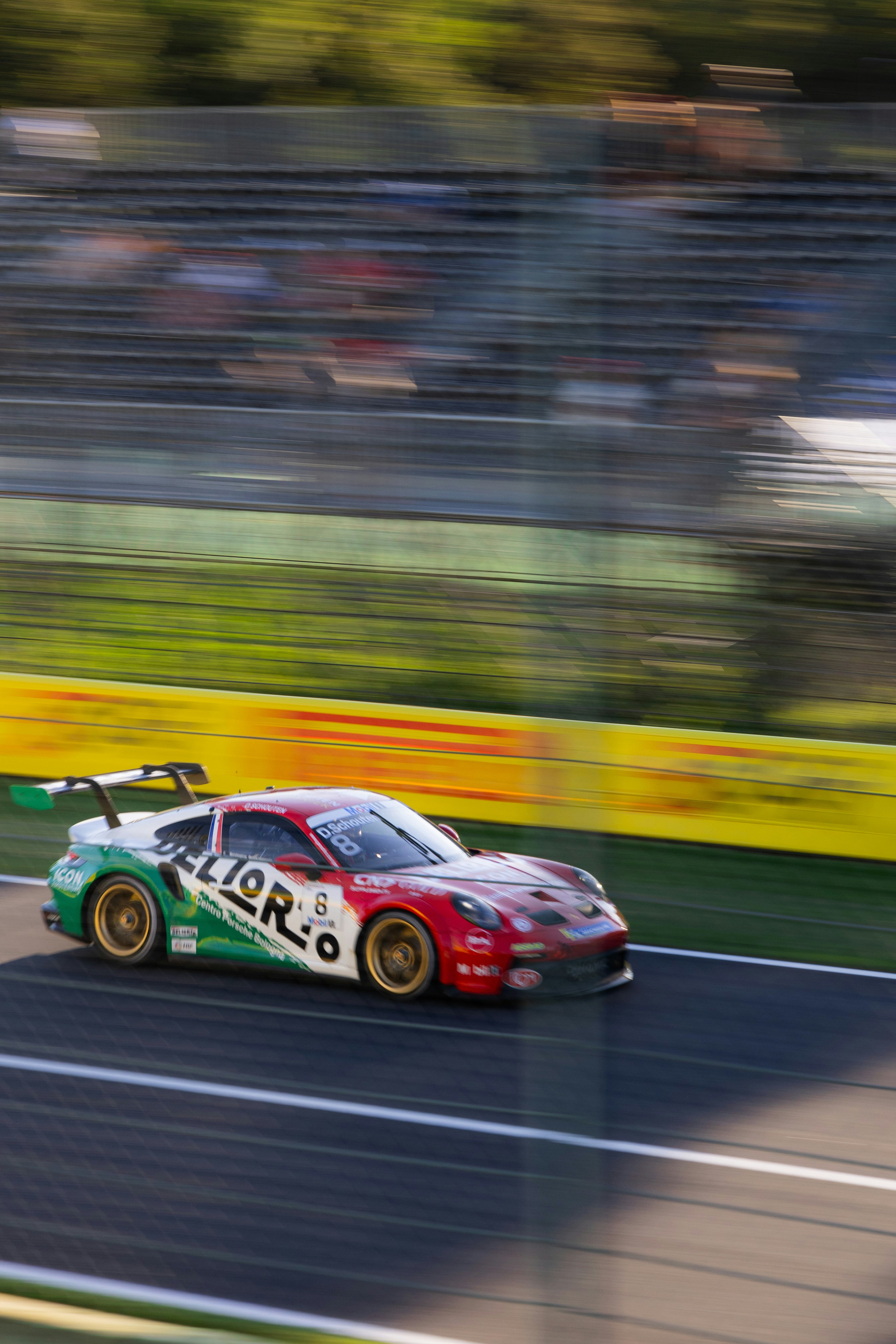 Race car speeding on a track with blurred background