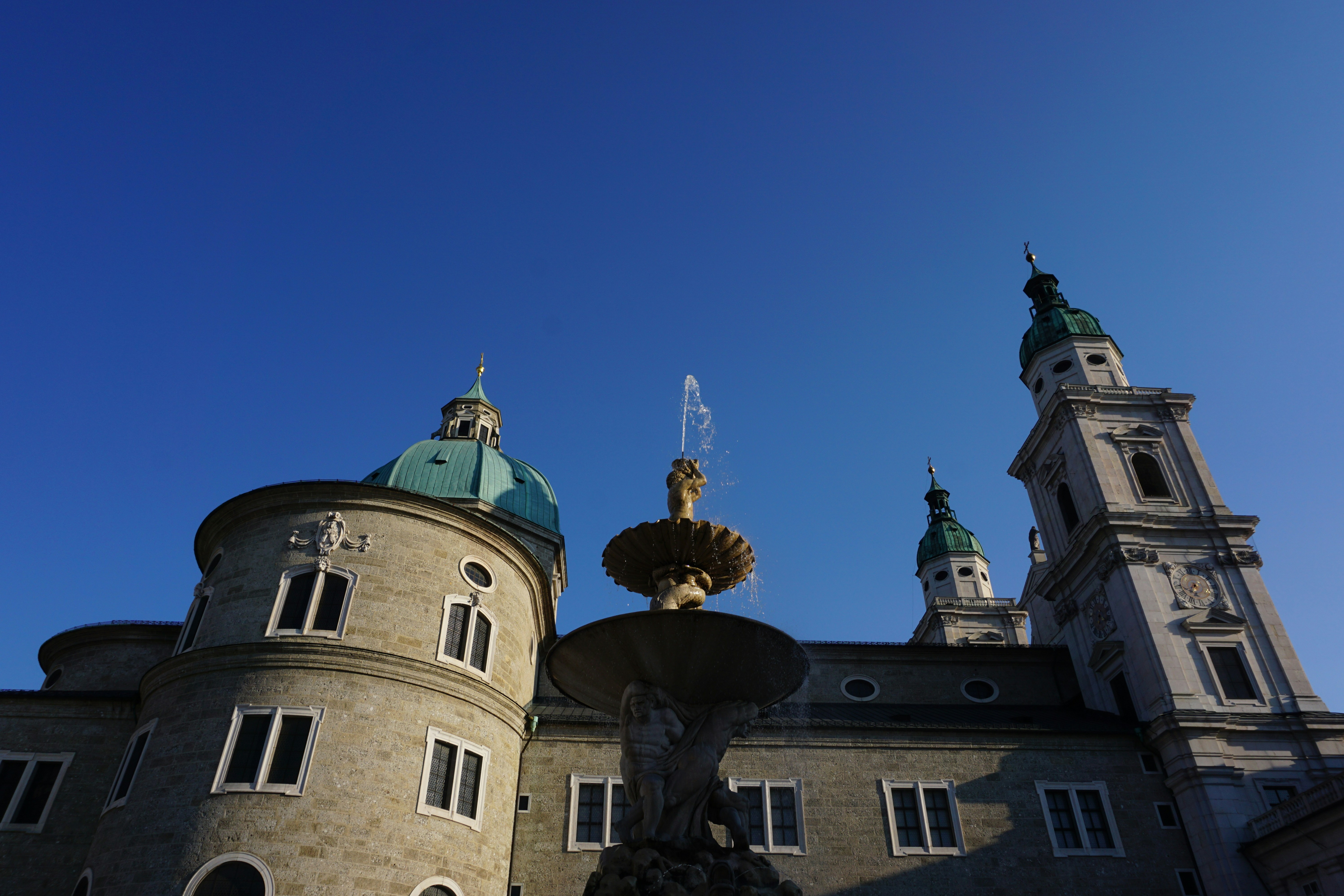 Fountain in front of historic european buildings