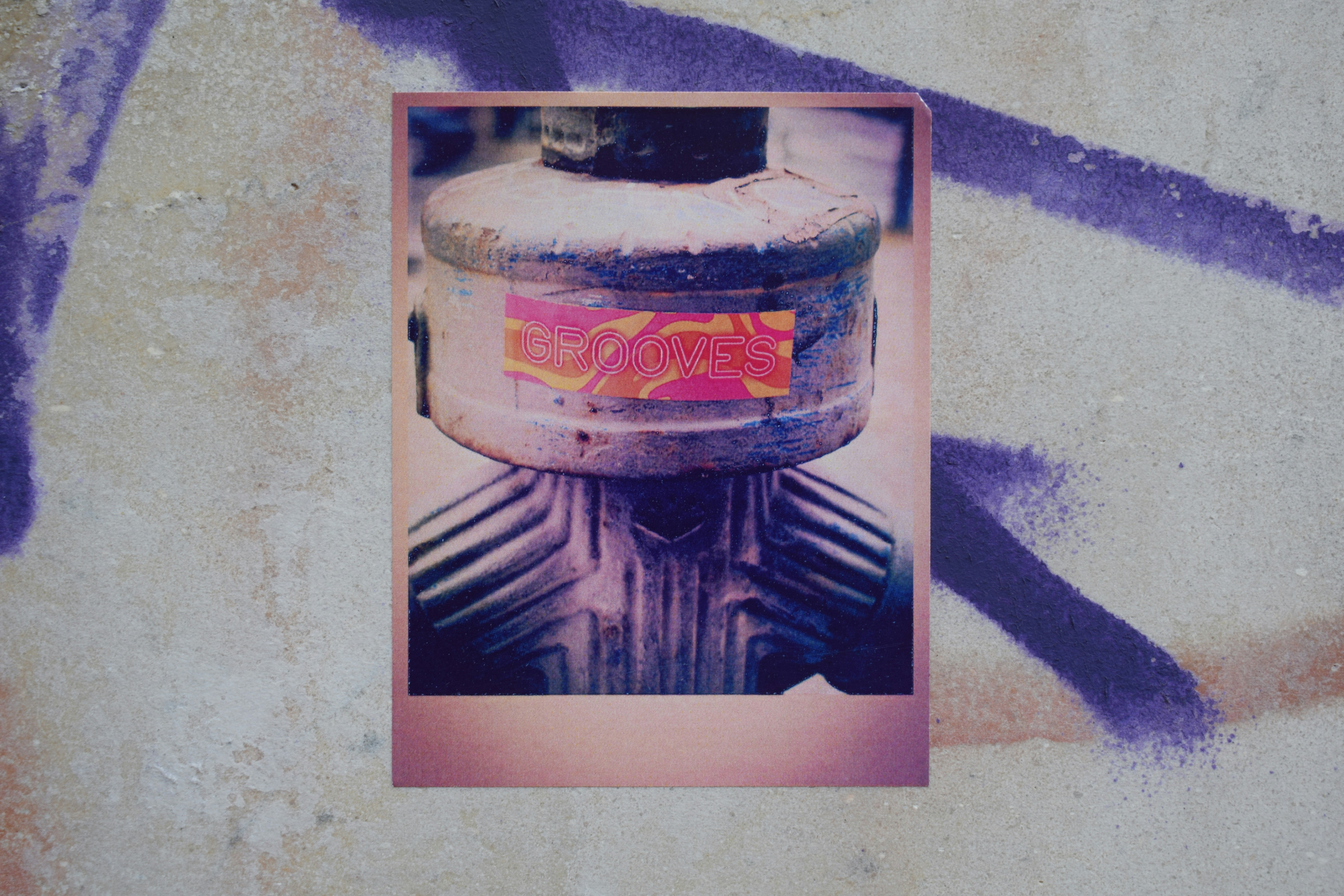 Close-up of a gas mask with colorful sticker on it.
