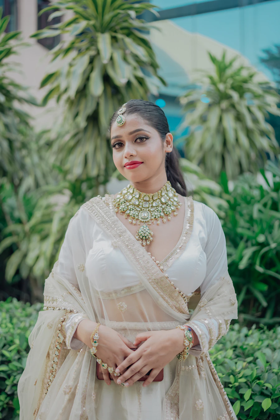Ivory lehenga with a sheer dupatta
