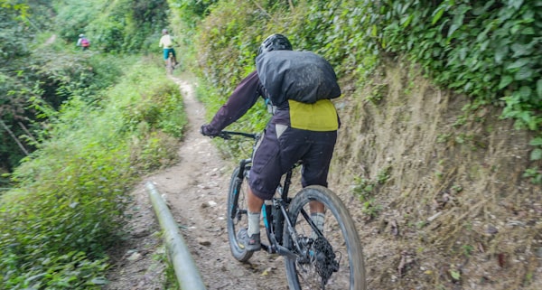 Expert mountain biker on exposed ridgeline trail at Gauntlet Gold, VCMP