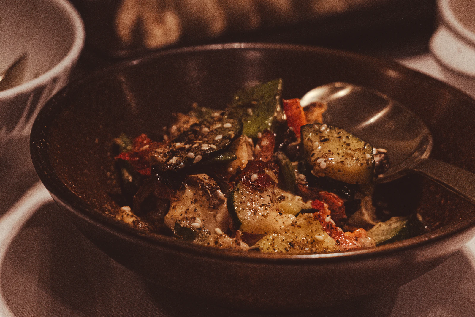 Roasted vegetables in a bowl with herbs