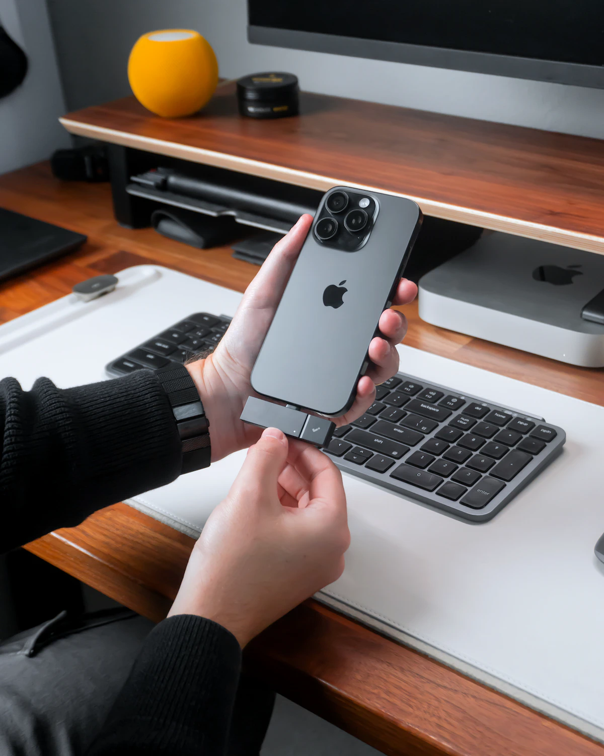 Customer holding an Apple iPhone