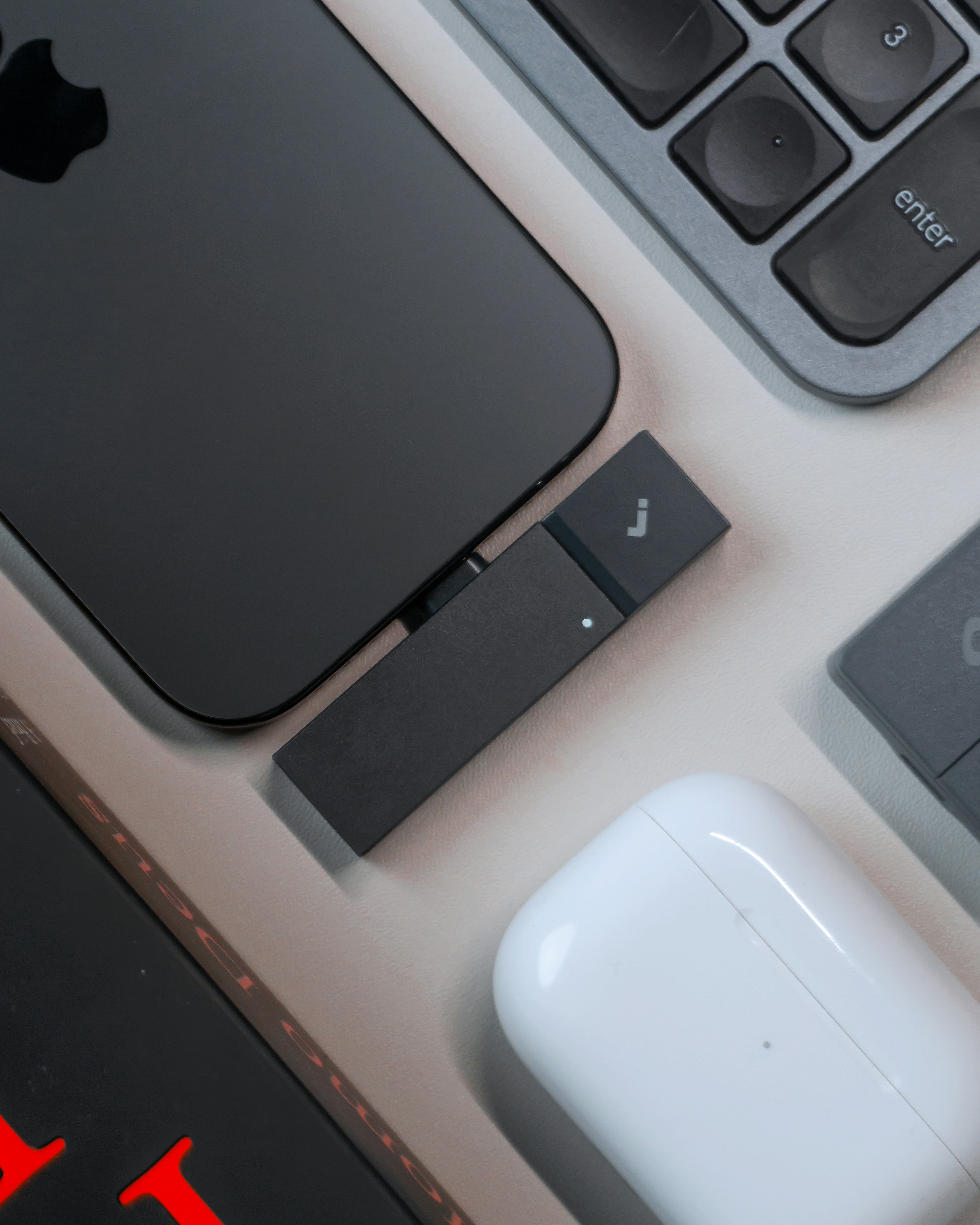 Smartphone, wireless earbuds, and keyboard on-screen keyboard