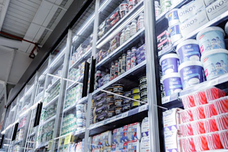 Shelves filled with various food products in a store.