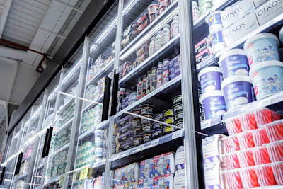 Shelves filled with various food products in a store.