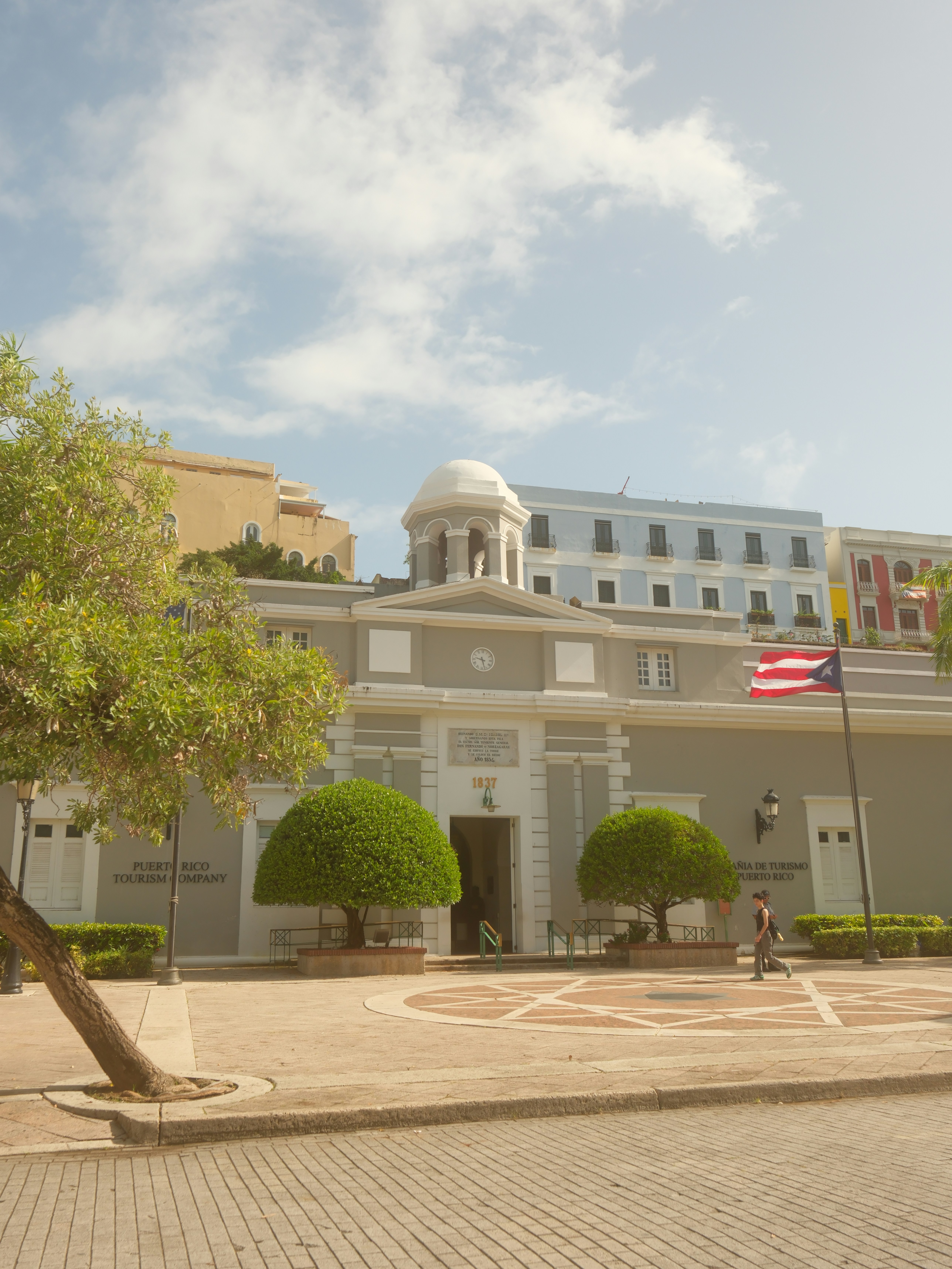 Historic building with puerto rican flag flying