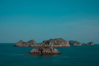 Jagged islands rise from the deep blue ocean.
