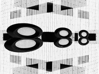 Abstract geometric pattern with oval shapes and reflections.