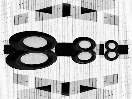 Abstract geometric pattern with oval shapes and reflections.