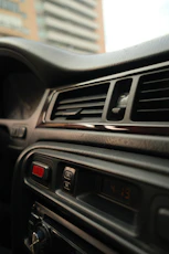 Car interior dashboard with air vents and buttons