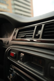 Car interior dashboard with air vents and buttons