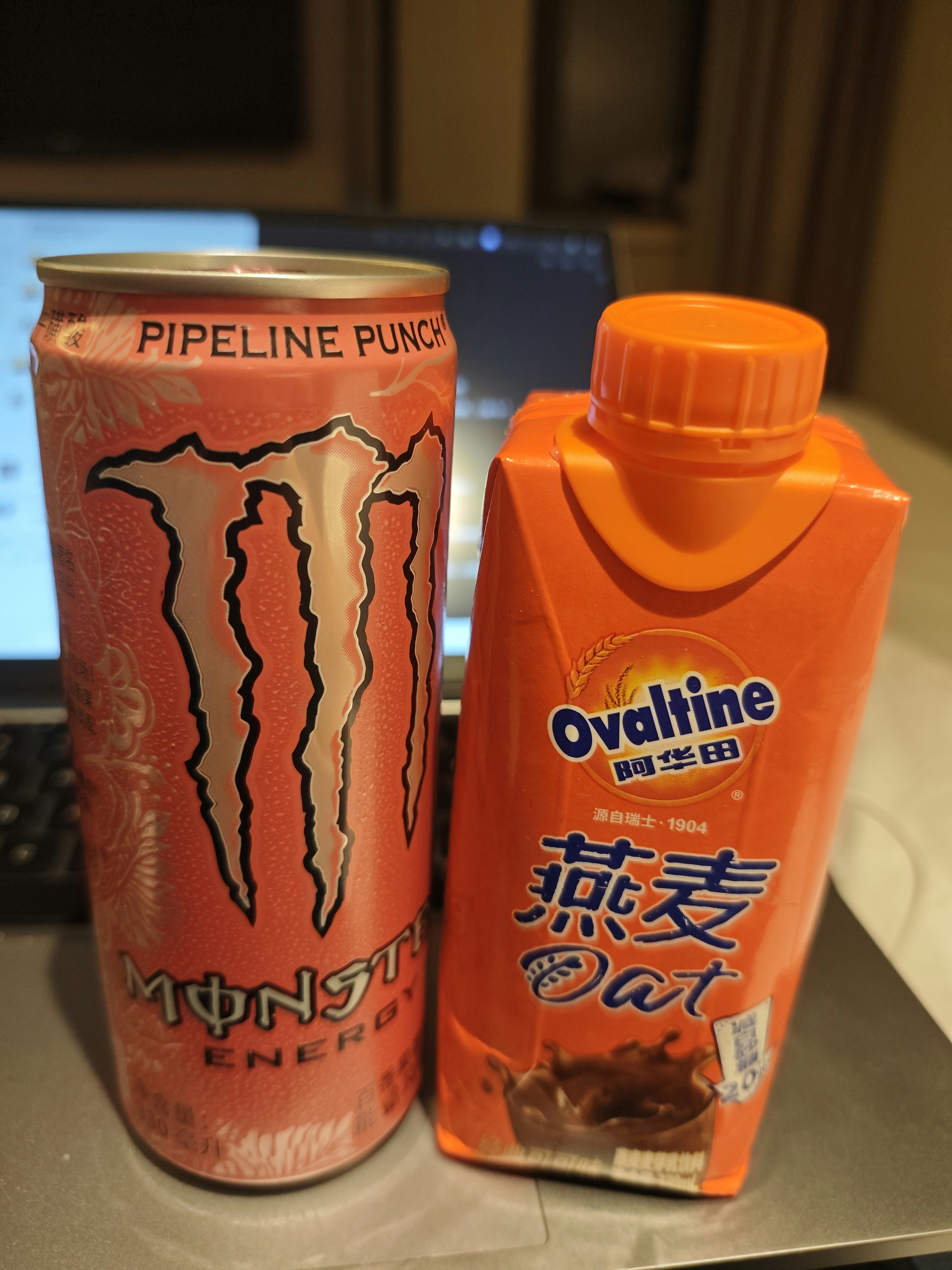 Monster energy and ovaltine oat drinks side by side.